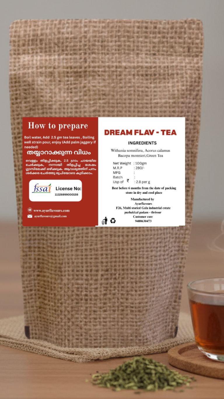 A package of Dream Flav tea by My Store with a colorful tea blend and a steaming cup of brewed tea on a wooden surface.