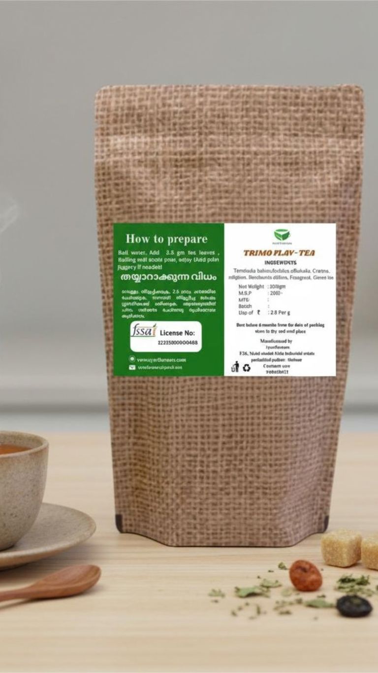 Trimo Flav Tea in a glass mug with lemon slices and mint leaves, showcasing a refreshing herbal tea beverage.