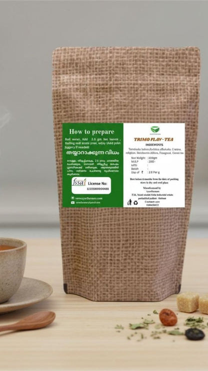 Trimo Flav Tea in a glass mug with lemon slices and mint leaves, showcasing a refreshing herbal tea beverage.