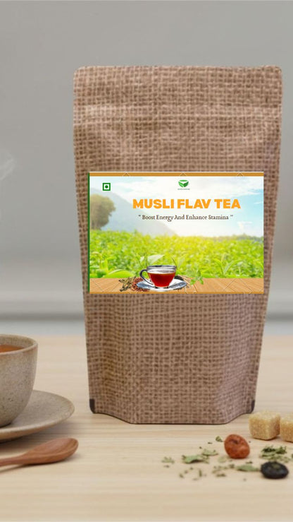 Musli Flav Tea in a clear glass cup with a tea infuser, showcasing the herbal blend and aromatic steam for a soothing beverage.